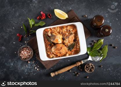 Hake fish, cooked in tomato sauce with vegetables and spices
