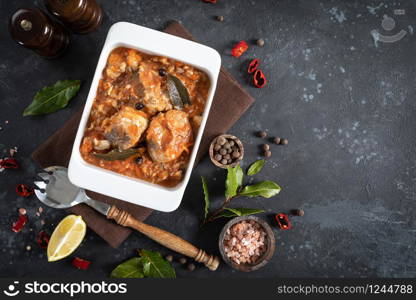 Hake fish, cooked in tomato sauce with vegetables and spices