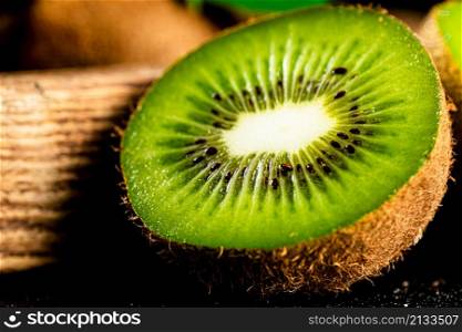 Half a ripe kiwi. Macro background. High quality photo. Half a ripe kiwi. Macro background.