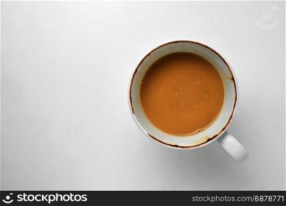 half coffee in cup isolated on white