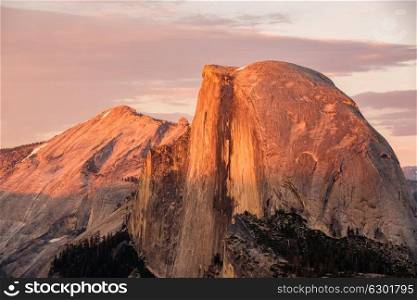 Half Dome rock formation close-up in Yosemite National Park summer sunset view from Glacier Point. California, USA.