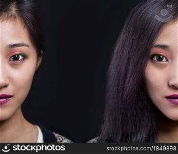 Half face beauty portrait of beautiful Asian American fashion model in makeup