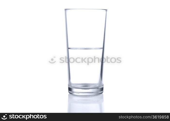 Half glass of water on white background