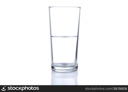 Half glass of water on white background