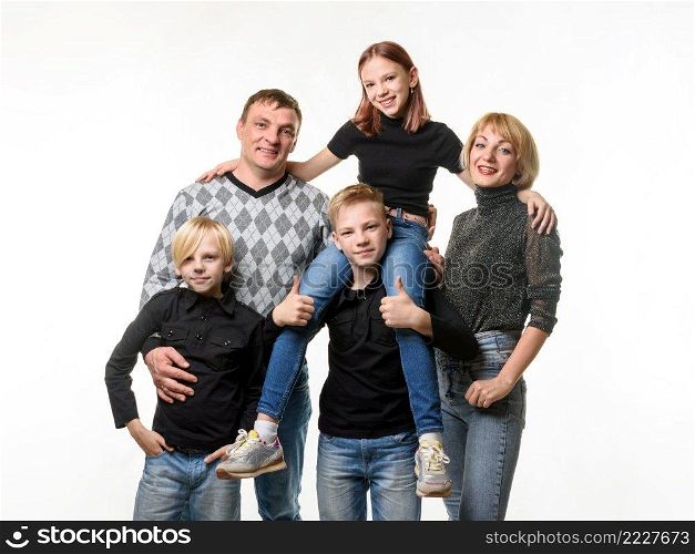 Half-length portrait of an ordinary Russian family in casual clothes on a white background a. Half-length portrait of an ordinary Russian family in casual clothes on a white background