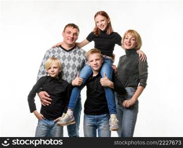 Half-length portrait of an ordinary Russian family in casual clothes on a white background a. Half-length portrait of an ordinary Russian family in casual clothes on a white background