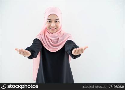 Half length portrait of asian beautiful Muslim young woman wearing business attire and hijab with mixed poses and gestures isolated on grey background. Suitable for technology, business finance theme.
