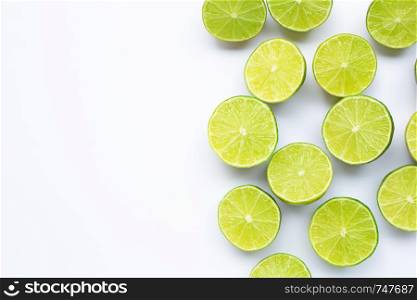 Half limes on white background. Copy space