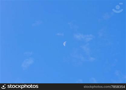 half moon in blue sky during the day