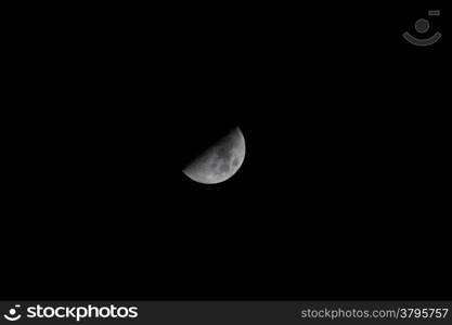 Half moon in clear cloudless dark black sky. Night skyscape. Nature. Astronomy science.