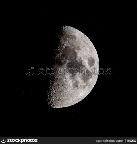 half moon in the night sky in december