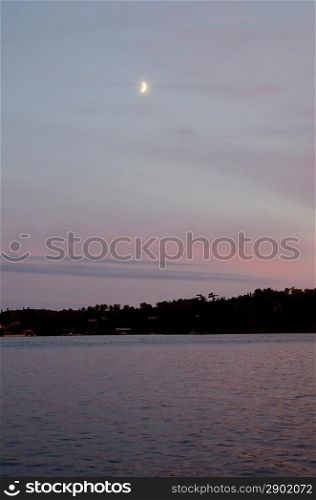 Half moon over the lake, Lake of the Woods, Ontario, Canada