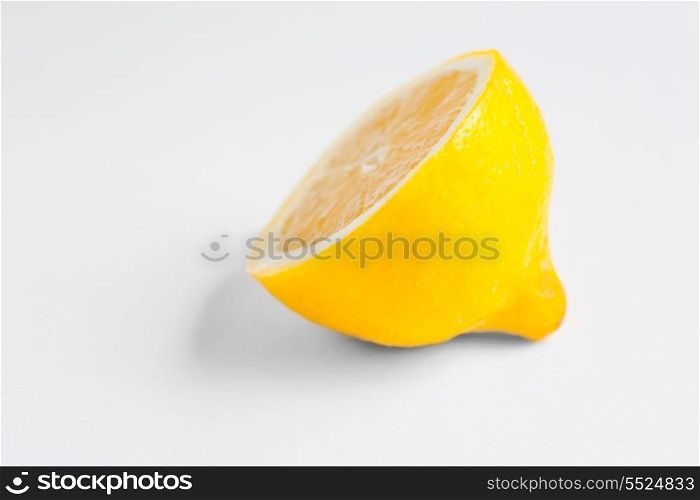 Half of a lemon on white background