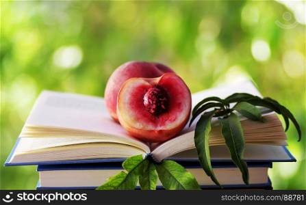 half of peach in open book