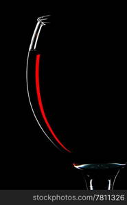 half of red wine glass isolated on black