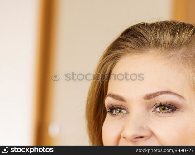 Half of young woman face. Pretty attractive female has beautiful green eyes and perfect eyebrows.. Half of woman face. Young female and her eyes