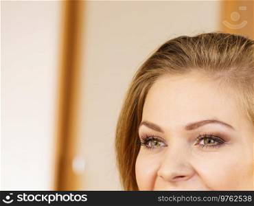 Half of young woman face. Pretty attractive female has beautiful green eyes and perfect eyebrows.. Half of woman face. Young female and her eyes