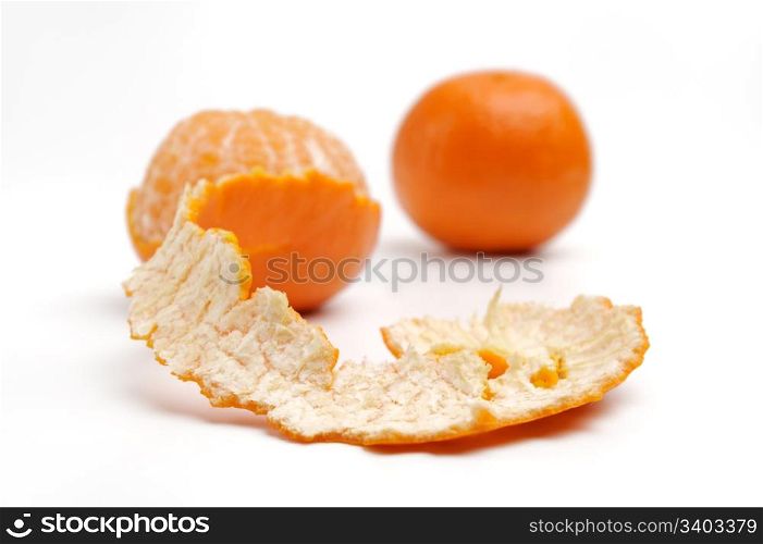 Half-peeled tangerine on a white background