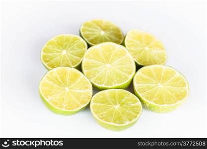 Half portion citrus lime slice on white background
