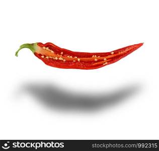 half red hot pepper with seeds isolated on a white background, close up