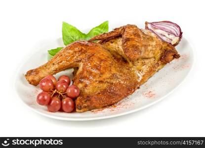 Half roasted chicken with grape on a white