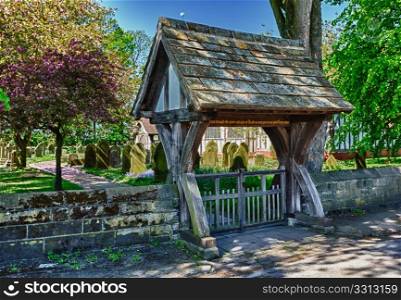 Half timbered church of Great Altcar near Formby in Lancashire, England seen through lych gate