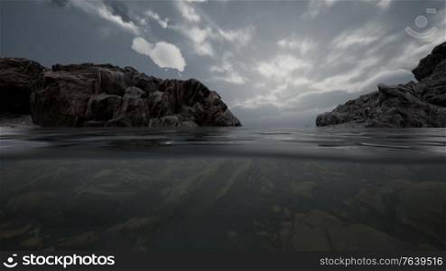 Half underwater in northern sea with rocks