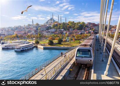 Halic metro bridge and view on the Suleymaniye Mosque, Istanbul.. Halic metro bridge and view on the Suleymaniye Mosque, Istanbul