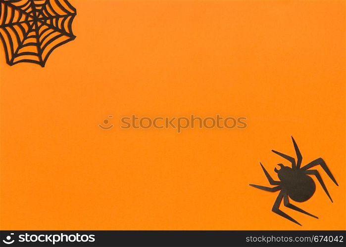 Halloween background. Black paper owl on orange background Happy halloween concept, space for text. Top view. Mockup, Layout Flat lay. Halloween background. Black paper owl in black frame on orange background