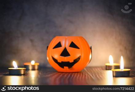 Halloween background candlelight orange decorated holidays festive concept / funny faces jack o lantern pumpkin halloween decorations for party accessories object with candle light on wood