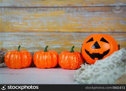 halloween background decorated holidays festive concept / jack o lantern pumpkin halloween decorations on white wooden background for party accessories object