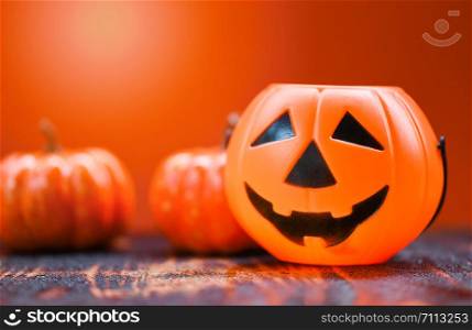 Halloween background orange decorated holidays festive concept / jack o lantern pumpkin halloween decorations for party accessories object on wood