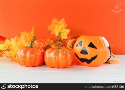 Halloween background orange decorated holidays festive concept / leaves autumn and jack o lantern pumpkin halloween decorations for party accessories object
