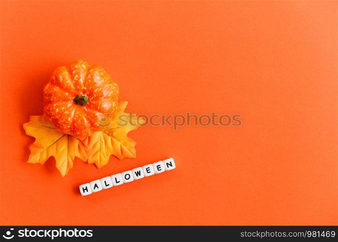 Halloween background orange decorated holidays festive concept / leaves autumn and jack o lantern pumpkin halloween decorations for party accessories object