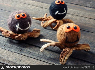 Halloween background with handmade pumpkin, funny spider, with knitted decoration for holiday seasonal, scary festival on october, orange is symbol color, so amazing with starfish, woolen spider