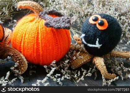 Halloween background with handmade pumpkin, funny spider, with knitted decoration for holiday seasonal, scary festival on october, orange is symbol color, so amazing with starfish, woolen spider