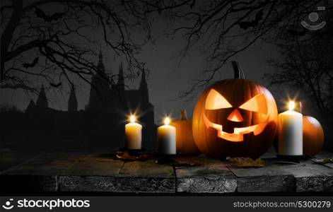 Halloween card with pumpkin. Halloween card with pumpkin and candles, gothic castle, trees and flying bats silhouette on background
