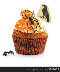 Halloween cupcake with whipped cream and decoration isolated on white