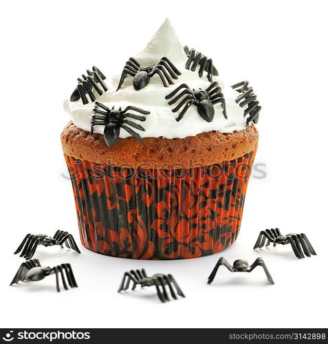 Halloween cupcake with whipped cream and decoration isolated on white