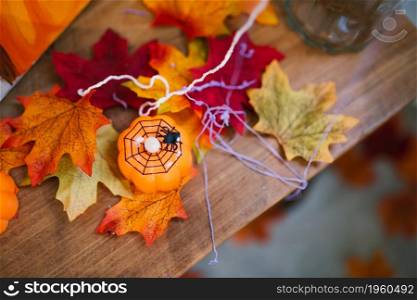 Halloween decorationsbackground. Halloween Scary pumpkin head on wooden table Halloween holiday concept.