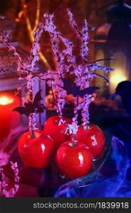 Halloween dessert. Poisoned blood caramelized glazed candy apple. Snow White Poison Lollipops.
