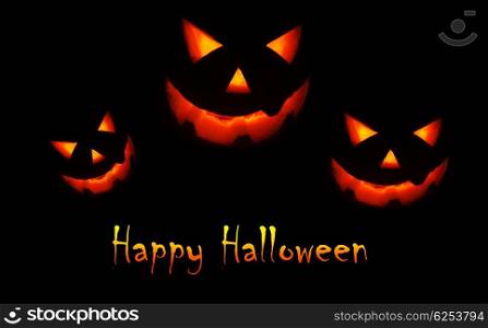 Halloween holiday background with glowing jack-o-lantern in the darkness