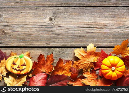 Halloween homemade gingerbread cookies over wooden background