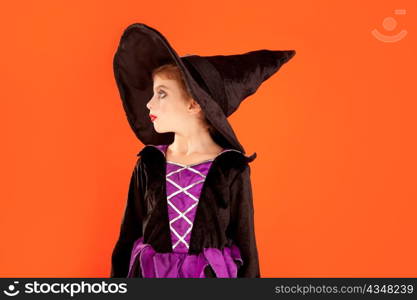 Halloween kid girl costume on orange background