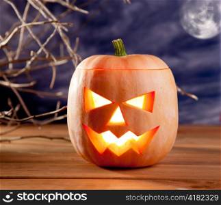 halloween lantern pumpkin in dark sky clouds moonlight