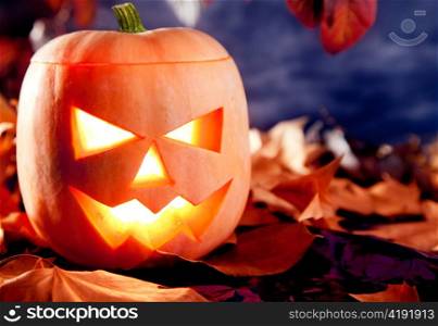 halloween lantern pumpkin in dark sky clouds moonlight