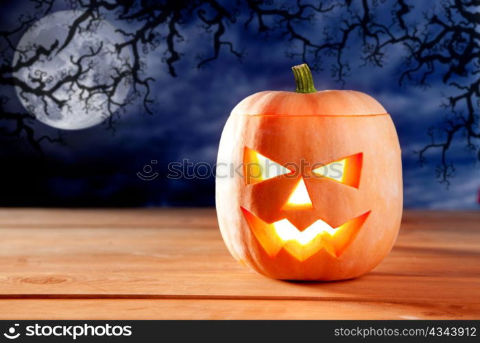 halloween lantern pumpkin in dark sky clouds moonlight