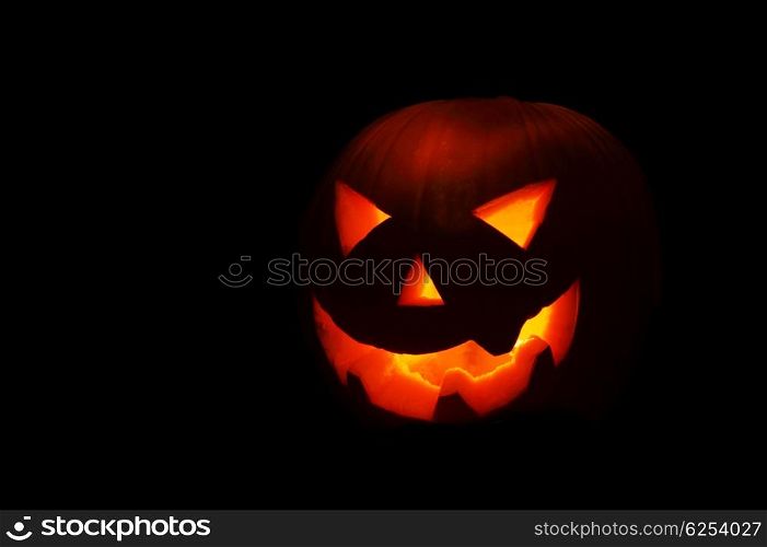 Halloween nightmare with glowing jack-o-lantern in the darkness