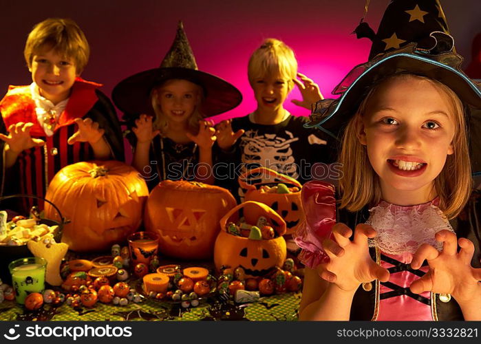 Halloween party with children wearing scaring costumes