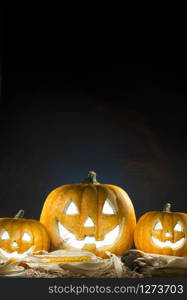 Halloween Pumpkin Burning with copy space. Dark background